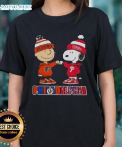 Cute Charlie Brown fist bump with Snoopy, perfect for Philadelphia sports fans. Phillies and Flyers ladies tee design.