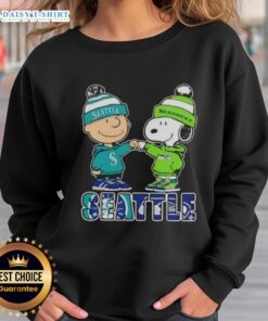Cute Charlie Brown and Snoopy fist bump in Seattle sports sweatshirt featuring Mariners and Seahawks logos.