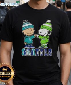 Alt Text: Cute Charlie Brown fist bump with Snoopy on Seattle sports T-shirt featuring Mariners and Seahawks design.