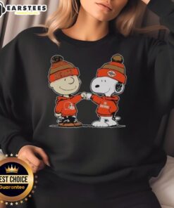 Alt Text: Cute Cleveland Browns Snoopy and Charlie Brown Best Friends sweatshirt featuring vibrant graphics for fans.