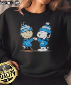 Alt Text: Cute Detroit Lions Snoopy and Charlie Brown Best Friends sweatshirt featuring playful cartoon design and team colors.