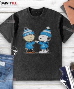 Cute Detroit Lions Snoopy and Charlie Brown best friends graphic on a washed t-shirt, perfect for fans.