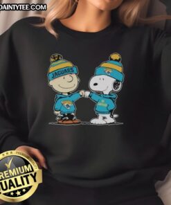 Cute Jacksonville Jaguars Snoopy and Charlie Brown best friends sweatshirt featuring playful design and team colors.