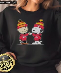 Alt Text: Cute Kansas City Chiefs Snoopy and Charlie Brown Best Friends sweatshirt featuring vibrant team colors and playful design.