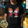 Alt Text: Cute Kansas City Chiefs Snoopy and Charlie Brown best friends t-shirt design featuring playful cartoon characters.