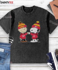 Alt Text: Cute Kansas City Chiefs Snoopy and Charlie Brown best friends graphic on a washed t-shirt for NFL fans.