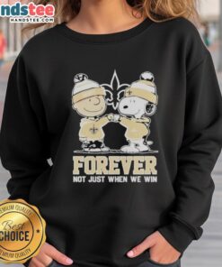 Alt Text: Cute New Orleans Saints sweatshirt featuring Charlie Brown and Snoopy, perfect for fans celebrating every game day.