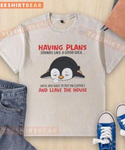 Cute penguin wearing a washed t-shirt, contemplating plans before leaving the house. A fun idea for penguin lovers!
