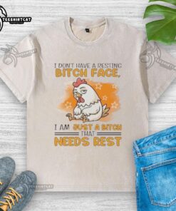 Alt Text: Cute rooster graphic on a relaxed-fit t-shirt featuring the phrase I don't have a resting bitch face, I need rest.
