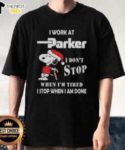Alt Text: Cute Snoopy graphic T-shirt featuring I Work At Parker Hannifin I Dont Stop When Im Tired for Christmas.