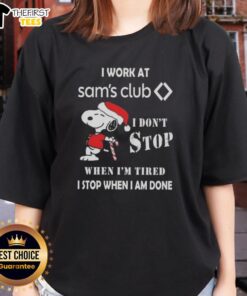 Alt Text: Cute Snoopy Christmas ladies tee with 'I work at Sam's Club. I don't stop when I'm tired; I stop when I'm done.'