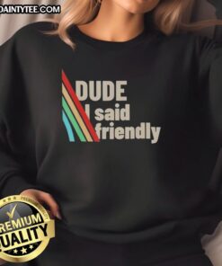 Alt Text: Funny dude wearing a Friendly ARC Raiders sweatshirt, showcasing a playful design and cozy style in casual setting.