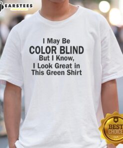 Person wearing a green t-shirt with a humorous quote about color blindness, showing confidence in their green outfit.