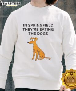 Funny Springfield sweatshirt featuring the phrase 'They're Eating the Dogs' in vibrant colors, perfect for casual wear.
