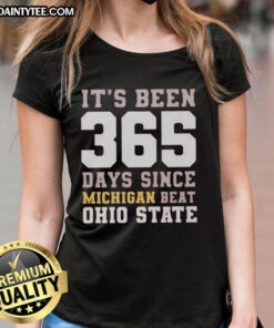 Funny 'It's Been 365 Days Since Michigan Beat Ohio State' ladies tee showcasing team spirit and humor in sports fashion.