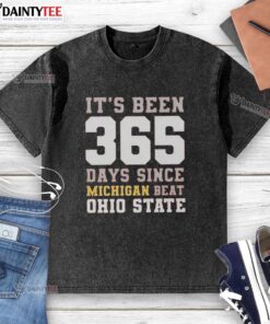 Funny 'It's Been 365 Days Since Michigan Beat Ohio State' washed t-shirt, perfect for college football fans and rivalry supporters.