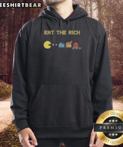Funny Pacman Eat the Rich Hoodie featuring a colorful graphic of Pacman devouring dollar signs and a playful slogan.