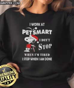 Funny Snoopy Christmas sweatshirt featuring the phrase 'I work at PetSmart, I dont stop when Im tired'.