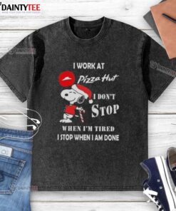 Funny Snoopy Christmas t-shirt design featuring 'I Work At Pizza Hut, I Don't Stop When I'm Tired' slogan.