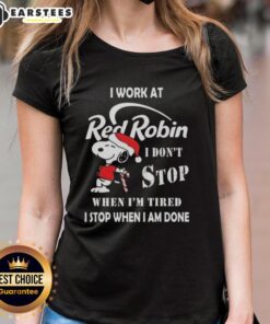 Alt Text: Funny Snoopy graphic tee for ladies, featuring 'I work at Red Robin, I don't stop when I'm tired' design for Christmas.