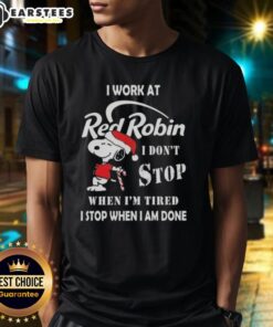 Alt Text: Funny Snoopy Christmas T-Shirt featuring I Work At Red Robin, I Dont Stop When Im Tired slogan.