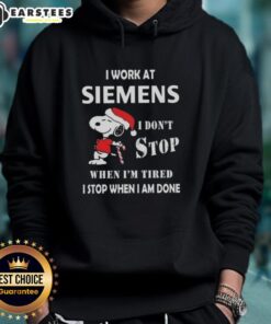 Funny Snoopy Christmas hoodie featuring 'I work at Siemens, I dont stop when Im tired, I stop when I am done' quote.