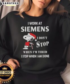 Alt Text: Funny Snoopy sweatshirt featuring I work at Siemens, I dont stop when Im tired, I stop when Im done design.