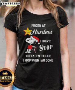 Alt Text: Funny Snoopy Christmas tee for ladies saying, 'I work at Hardee's, I dont stop when Im tired, I stop when Im done.'