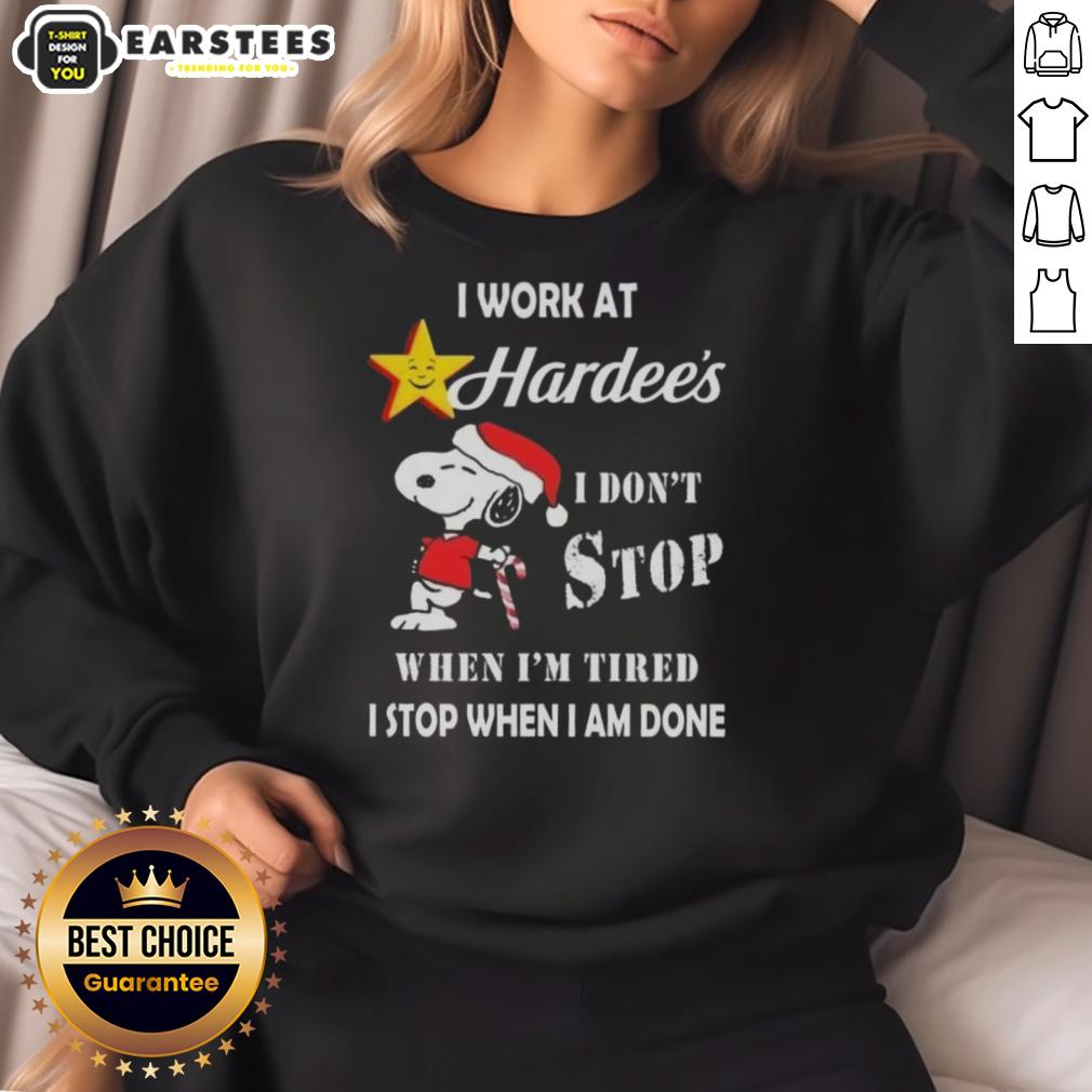 funny-snoopy-i-work-at-the-hardees-i-dont-stop-when-im-tired-i-stop-when-i-am-done-christmas-sweatshirt Funny Snoopy sweatshirt featuring 'I work at Hardee's, I don't stop when I'm tired, I stop when I'm done' Christmas design.