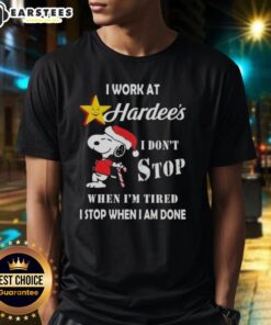 Alt Text: Funny Snoopy Christmas T-shirt featuring I Work At The Hardee's I Don't Stop When I'm Tired slogan.