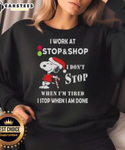 Funny Snoopy Christmas sweatshirt with 'I don't stop when I'm tired, I stop when I'm done' text, perfect for holiday shopping.