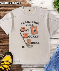 Funny Yeah I Like G.H.B. Gay Hockey Books washed t-shirt featuring a vibrant graphic design and playful text.