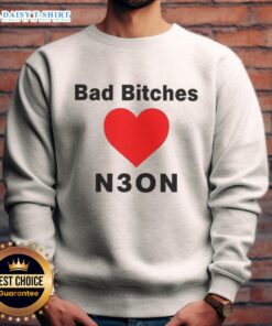 Women wearing a 'Good Bad Bitches Love Neon' sweatshirt in vibrant neon colors, showcasing trendy streetwear fashion.