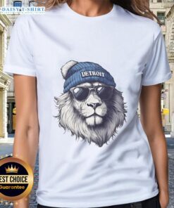 Detroit Lions mascot wearing a beanie and sunglasses on a ladies' tee, showcasing team spirit and style.