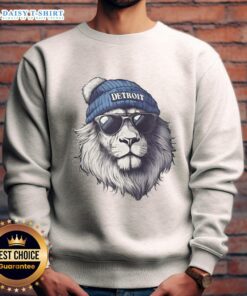 Detroit Lions mascot wearing a beanie, sunglasses, and a sweatshirt, showcasing team spirit and style.