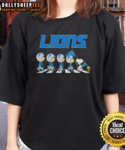 Alt Text: Good Detroit Lions X Peanuts Snoopy and Friends Abbey Road ladies tee featuring iconic characters and team colors.