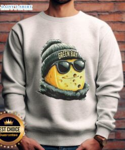 Good Green Bay Packers mascot in a beanie and sunglasses, sporting a sweatshirt at a game, showcasing team spirit.