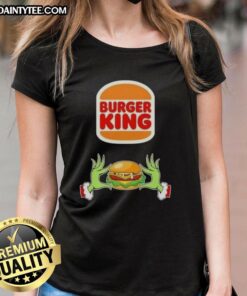 Alt Text: Good Grinch hands holding a Burger King logo on a Merry Christmas ladies tee, festive holiday apparel.