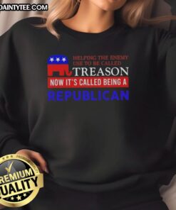 Good Helping The Enemy sweatshirt with a political statement about treason and being a Republican, showcasing bold text design.