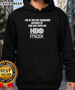 Young man wearing 'Good I'm At The Boy Aquarium' hoodie inspired by two gay guys on HBO Max, smiling at the aquarium.