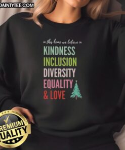 Alt Text: Festive Christmas tree sweatshirt featuring the phrase In this home, we believe in kindness, inclusion, diversity, equality, and love.