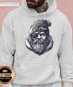 Las Vegas Raiders mascot wearing a beanie and sunglasses, showcasing team spirit in a stylish hoodie.