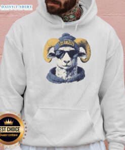 Los Angeles Rams mascot wearing a beanie and sunglasses, showcasing team spirit in a stylish hoodie.