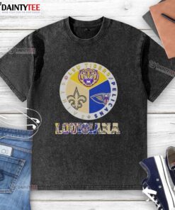 LSU Tigers, Pelicans, and Saints washed t-shirt showcasing Louisiana city sports pride in vibrant colors.