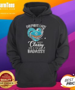 Alt Text: Stylish woman wearing a Miami Dolphins hoodie, showcasing a sassy and classy design with diamond heart accents.