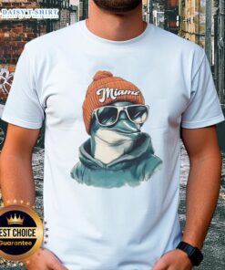 Alt Text: Good Miami Dolphins mascot in a beanie and sunglasses, showcasing team spirit on a trendy t-shirt.