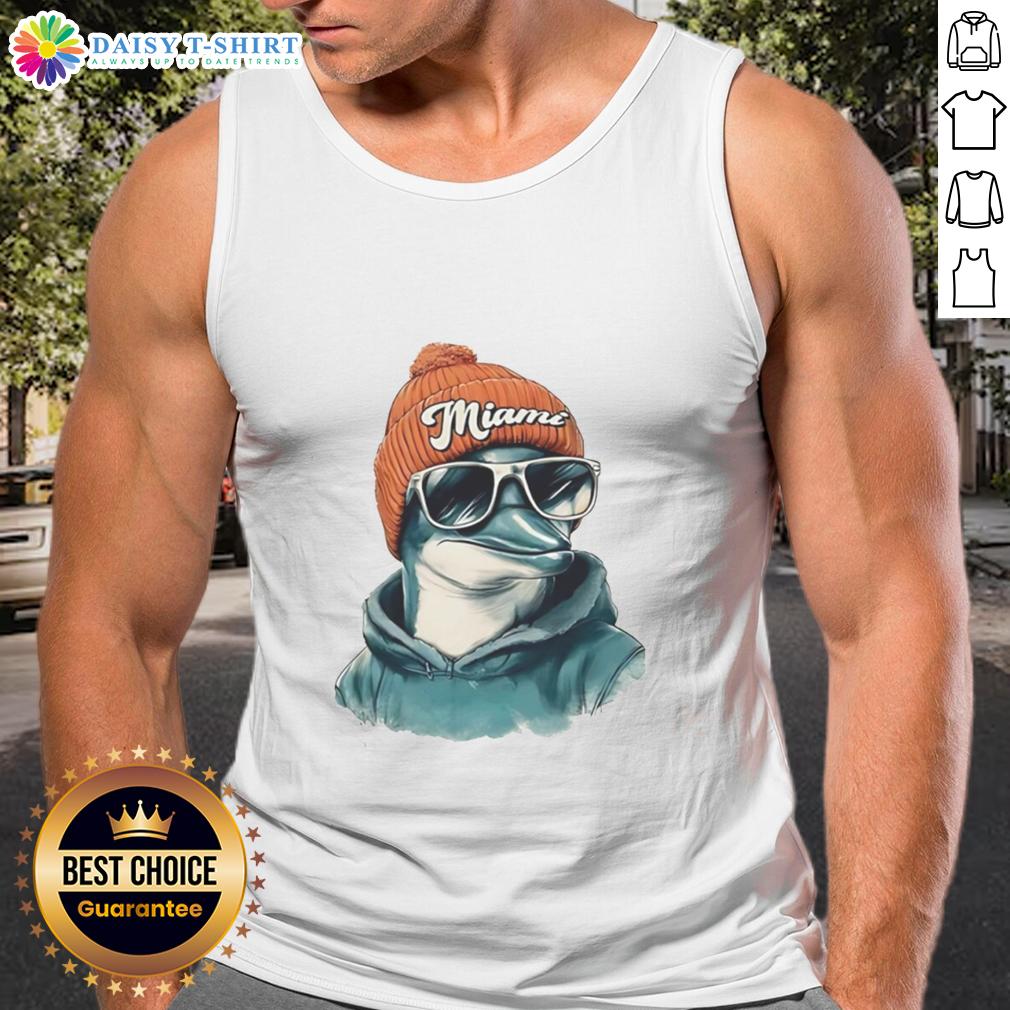 Good Miami Dolphins Mascot Wearing A Beanie And Sunglasses Tank Top Miami Dolphins mascot in a beanie, sunglasses, and tank top, showcasing team spirit at a game.