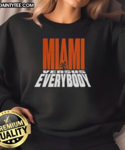 Alt Text: Miami Hurricanes Football sweatshirt featuring the Miami Versus Everybody mascot silhouette design.