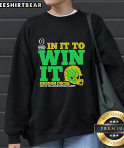 Good Oregon Ducks In It To Win It CFP 2025-26 helmet sweatshirt, showcasing team spirit and vibrant design for fans.