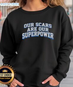 Alt Text: Good Our Scars Are Our Superpower sweatshirt in vibrant colors, promoting self-acceptance and resilience.